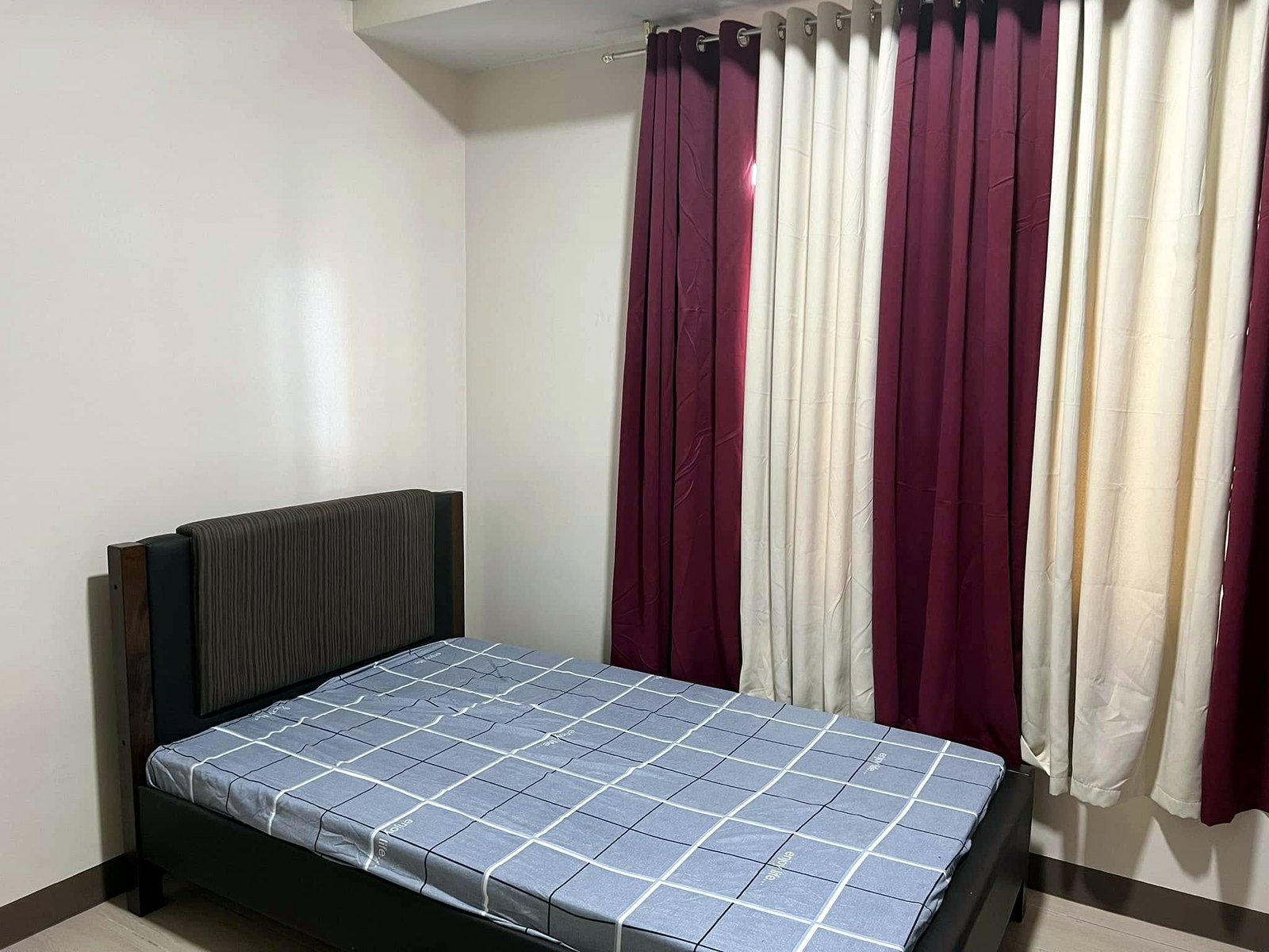Bedroom with bed and curtains